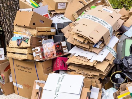Mountains of cardboard on the street Waste paper from packaging is collected