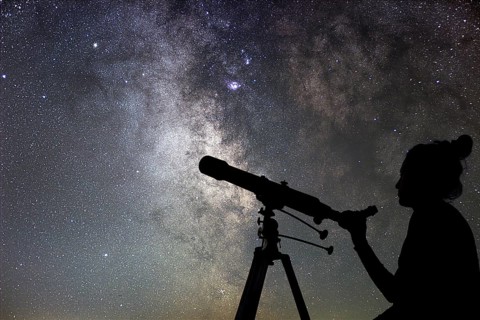 Woman and night sky. Watching the stars Woman with telescope