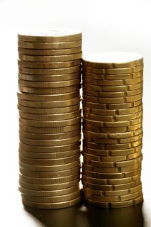 Euro coin columns, golden cash over white background at studio