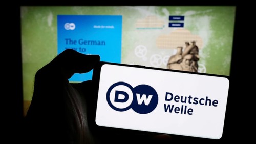 Stuttgart, Germany, 04-10-2024: Person holding mobile phone with logo of German state-owned