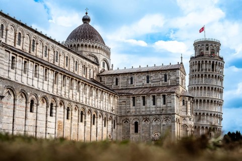 Historic architecture with the Leaning Tower of Pisa under a blue sky, Pisa, Italy, Europe