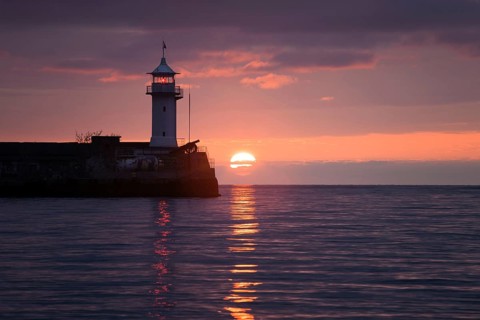 Lighthouse on sunrise. Yalta, Crimea, Ukraine, Europe