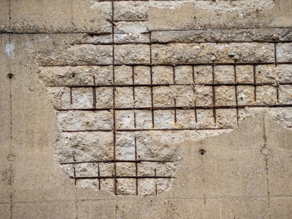 Old wall background with concrete and rusty metal