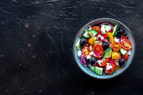 Greek salad. Fresh tomato, cucumber, bell pepper, Feta cheese, onion, and olives. Healthy summer