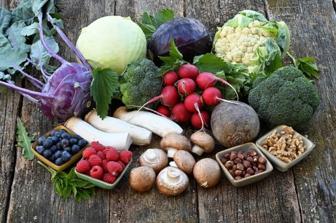 Healthy food, berries, cabbage, radishes, king oyster mushrooms, raspberries, nuts, blueberries,