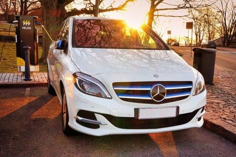 Mercedes-Benz B-Class Electric Drive electric car plugged in at public HELEN charging point.