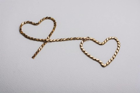 Heart shaped made of gold chain Valentines Day, love, romance concept