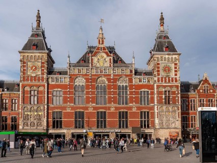 Impressive façade with two towers Neo-Renaissance building of Amsterdam Central Station, Amsterdam,