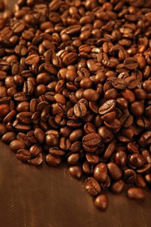 Toasted coffe beans texture under golden light
