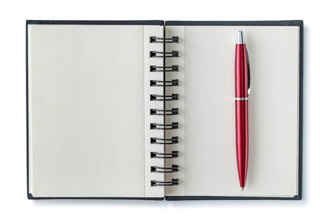 Opened Notepad With Red Ballpoint Pen Isolated