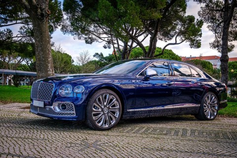 Lisbon, Portugal, Jan 20, 2024: Luxury Bentley Flying Spur Mulliner parked on a cobblestone road,