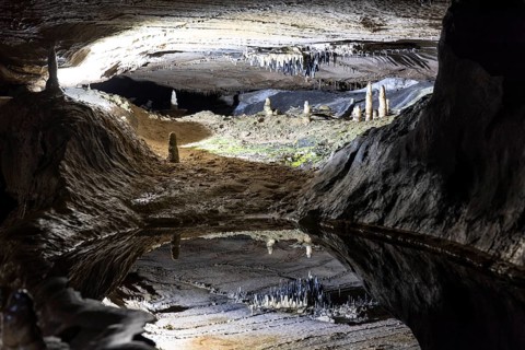 Pool of Reflections, stalactites reflected in a pool of water, stalactite cave, Ingleborough Cave,