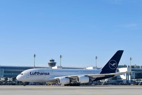 Lufthansa Airbus A380-800 with control tower, taxiing in front of Terminal 2 to runway South