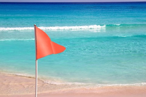Dangerous red flag in tropical beach for avoid bathing