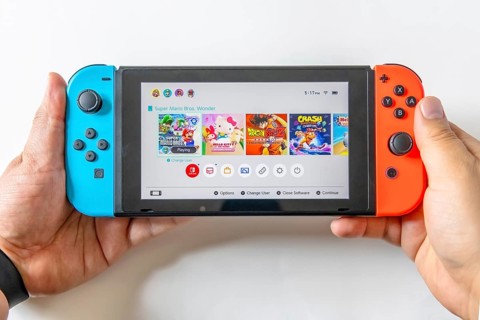 Calgary, Alberta, Canada. May 16, 2024. A person holding a Nintendo Switch