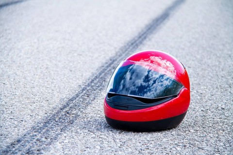 An accident with a motorbike. Traffic accident and skid marks on road Symbol photo, An accident