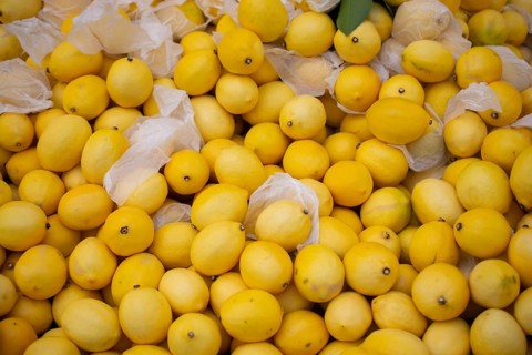 Lemons Citrus fruits on a market as texture or background