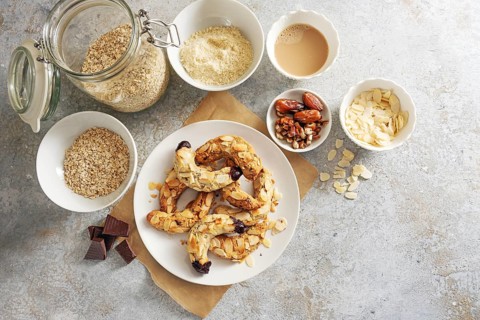 Healthy almond crescent cookies without sugar made from almonds, oat flakes and dates on a plate