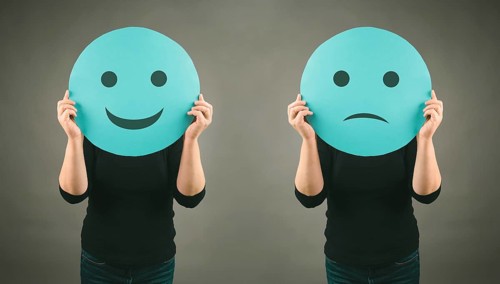 Head with a sad and a happy face, mental health concept, positive and negative mindset, depression,