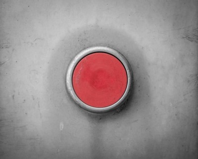 A Retro Filtered Image Of A Blank Red Industrial Button
