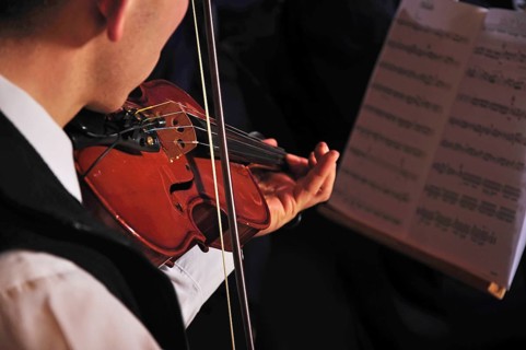 Violinists performing in live concert