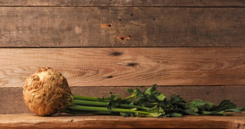 Organic celeriac on a rustic wooden table, healthy food, space for your text, organic ingredients,