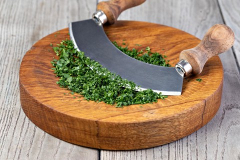 Parsley. On a chopping board in the kitchen