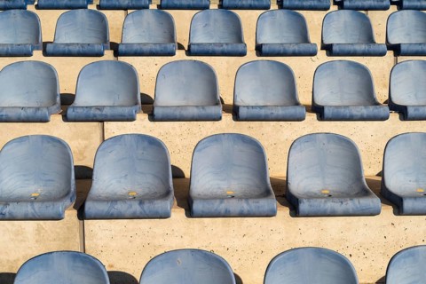 Rows with blue seat shells on a sports stand
