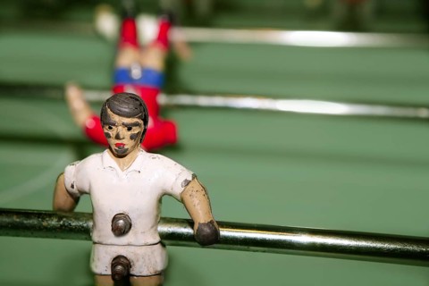 Aged table foosball player macro detail