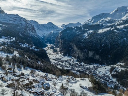 Lauterbrunnen Valley and Snowy Mountains on Sunny Winter Day. Swiss Alps. Switzerland. Aerial View.