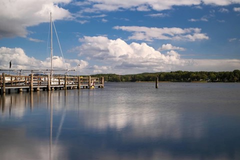 View over the Scharmützelsee with jetty and marina, long exposure, Wendisch-Rietz, Brandenburg,