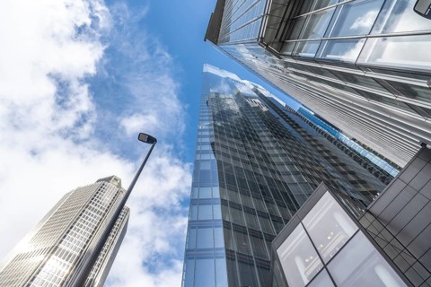 Low angle view of modern skyscrapers in london's financial district, showcasing their towering