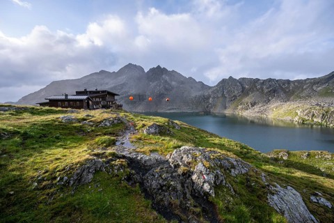 Mountain hut Wangenitzseehütte in the morning light, mountain landscape with mountain lake