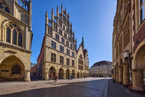 Old town, historic buildings, facade, window, gable, arcades, cobblestone street, pedestrians as