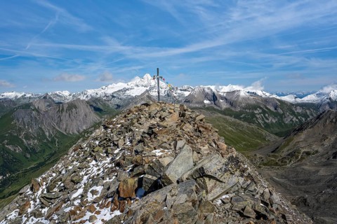 Böses Weibl summit with summit cross and colourful prayer flags, view of picturesque mountain