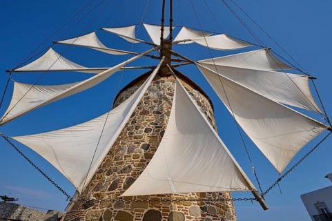 Sails of a stone windmill unfurl under a clear sky, Windmill, Antimacheia, Kos, Dodecanese, Greek