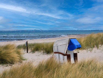 Beach chair dunes Strandwarder in front of Fehmarn bridge Heiligenhafen Baltic Sea Germany