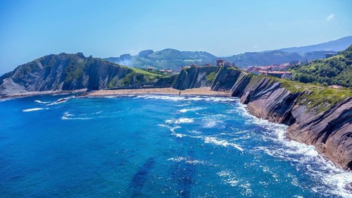 Breathtaking aerial view of zumaia's unique flysch coastline, showcasing its dramatic cliffs and