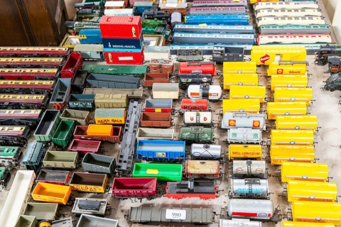 Model railway toy train set items on display for sale at auction room, UK