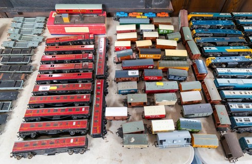 Model railway toy train set items on display for sale at auction room, UK