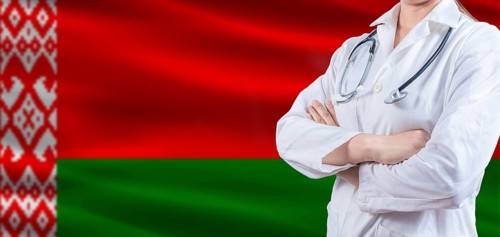 Doctor with crossed arms on Belarus flag. Belarus health and care concept. Female doctor on Belarus