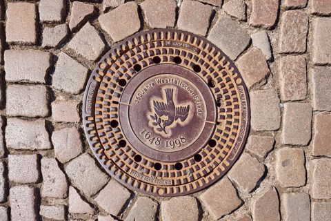 Manhole cover, dove of peace, 350 years of the Peace of Westphalia, 1648 to 1998, biblical symbol,
