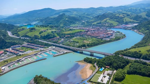 Aerial view of orio, a charming town in gipuzkoa, basque country, spain, showcasing the river,