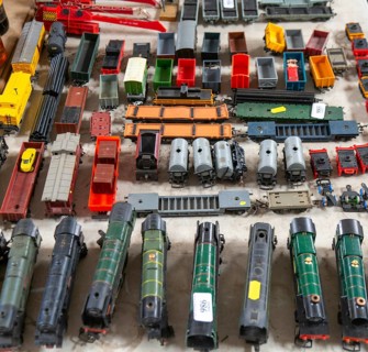 Model railway toy train set items on display for sale at auction room, UK