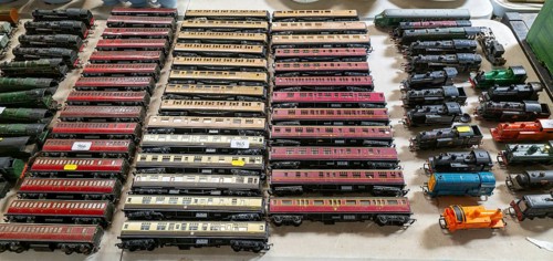 Model railway toy train set items on display for sale at auction room, UK