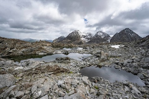 Small mountain lakes in a rocky mountain landscape, Niedere Gradenscharte, behind the summit of the