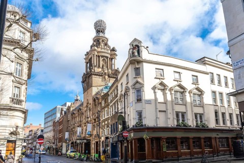 City street view featuring the london coliseum, a historic theatre located in st. Martin's lane,