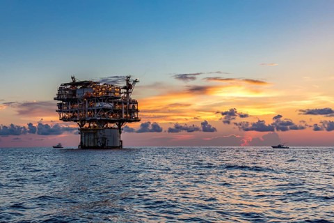 Private fishing boats near offshore petroleum drilling rig in the Gulf of Mexico