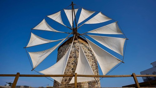 Large sails of a windmill over a wooden fence, Windmill, Antimacheia, Kos, Dodecanese, Greek