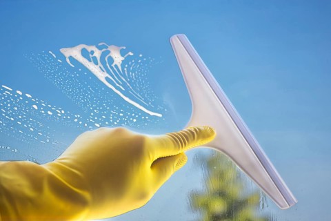 Glass cleaning: Close-up of a window pane being cleaned